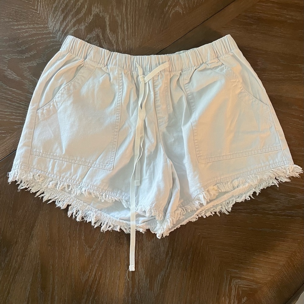 White cotton shirts with fringe